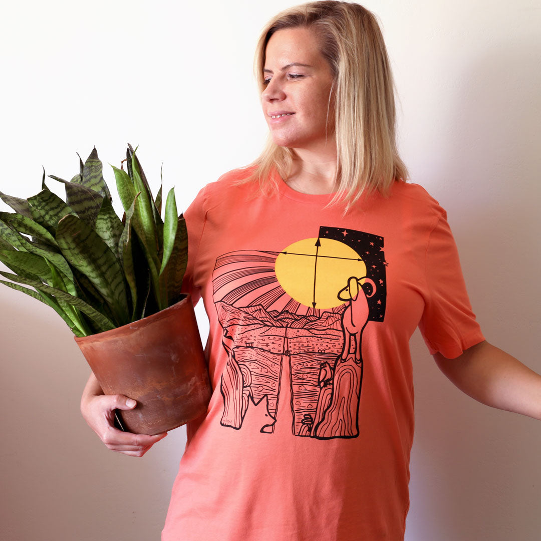 Woman wearing Safe Travels Desert Shirt in Coral